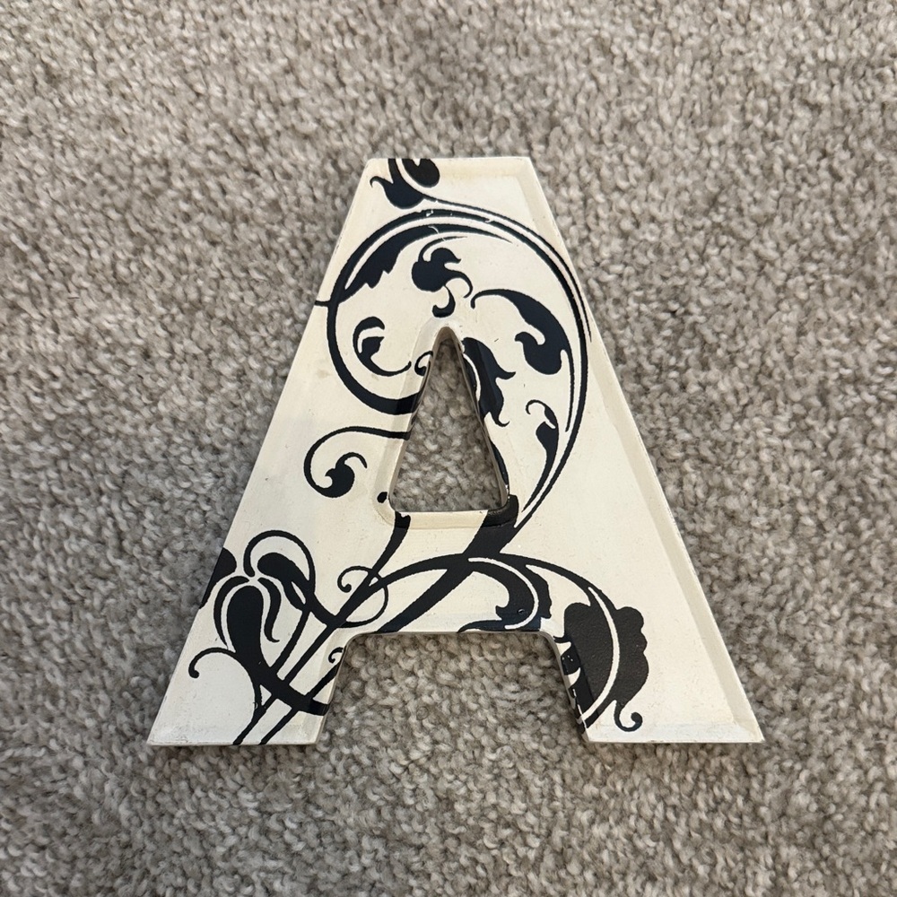 Decorative Letter A with Black Floral Design